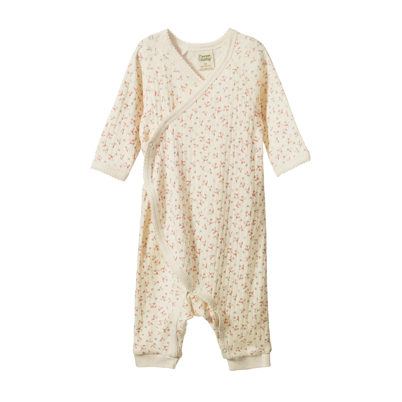 A baby long-sleeve footless sleep sack in cream with a tiny pink and green floral print, shown against a plain white background.