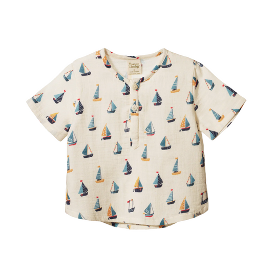 Short-sleeve shirt with sailboat pattern on a white background