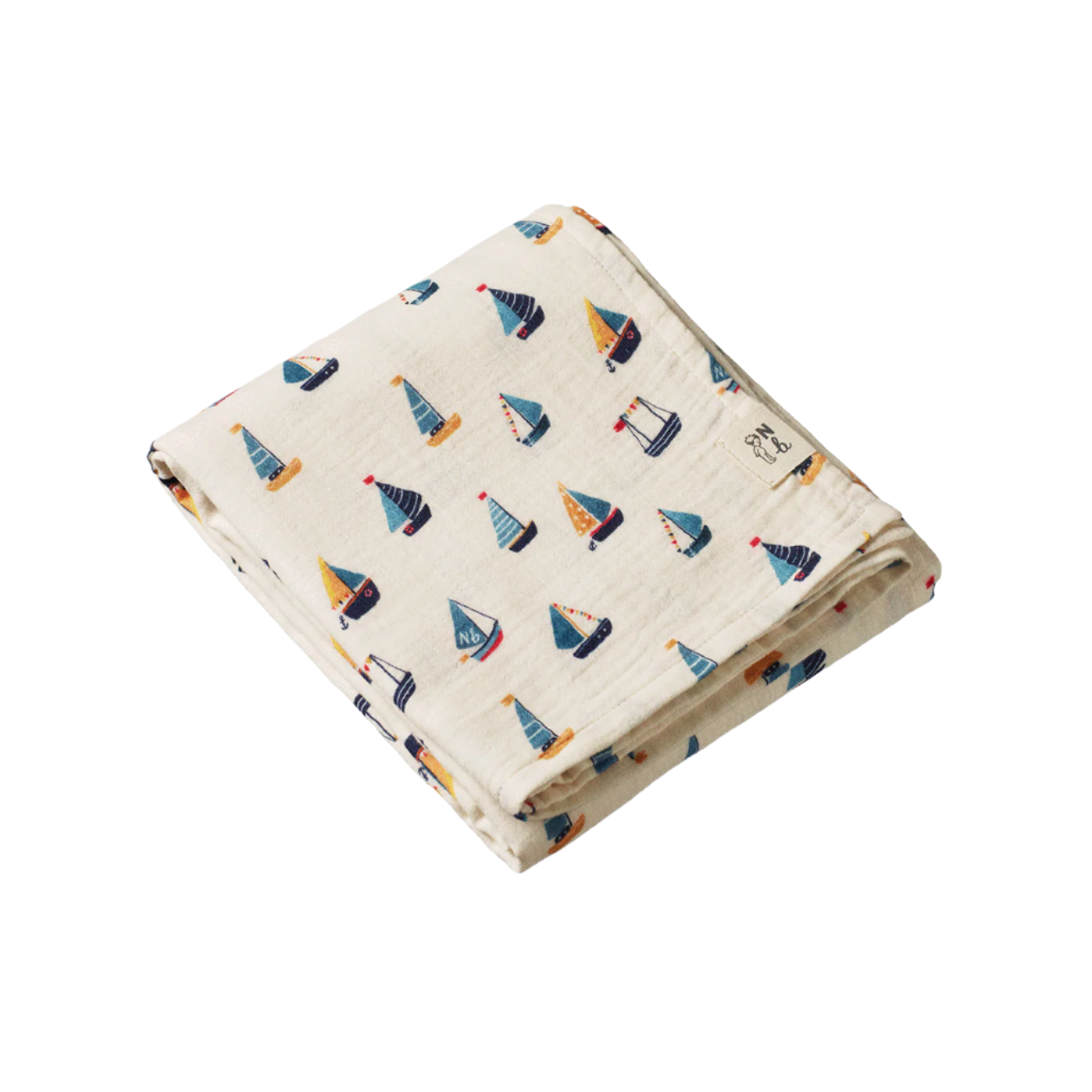 Folded fabric with sailboat pattern on a white background